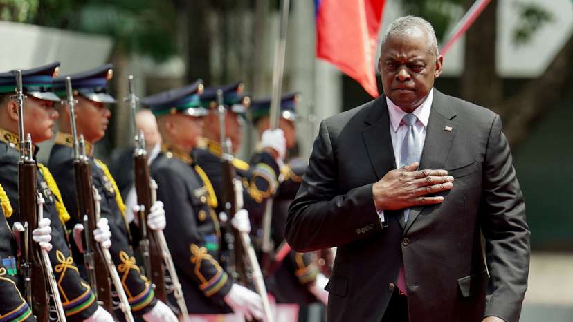 U.S. Secretary of Defense Lloyd Austin inspects honor guards during his arrival at Camp Aguinaldo, in Quezon City