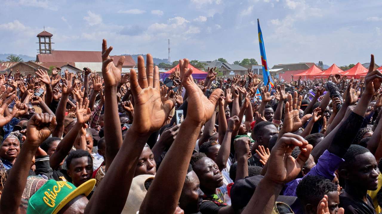 Mourners attend the funeral of Congolese musician Delphin Katembo Vinywasiki also known as Delcat Idengo, who denounced both his own government and the Rwandan-backed M23 rebels occupying much of the country's east before he was shot dead, ahead of his burial in Beni, Democratic Republic of Congo March 25, 2025. REUTERS/Gradel Muyisa Mumbere