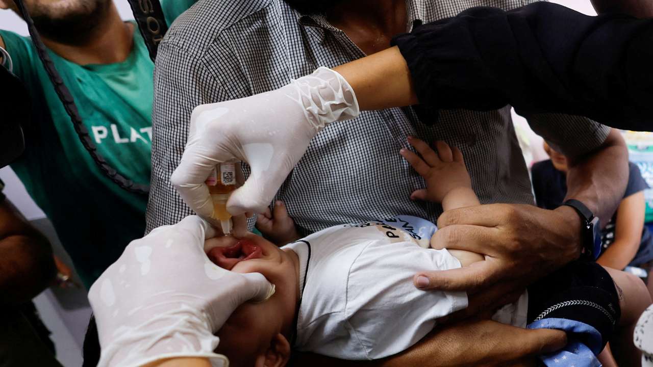 FILE PHOTO: Palestinian children are vaccinated against polio, at Nasser hospital in Khan Younis