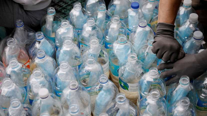 FILE PHOTO: North Korean defector group prepares plastic bottles filled with rice and masks to be sent towards North Korea