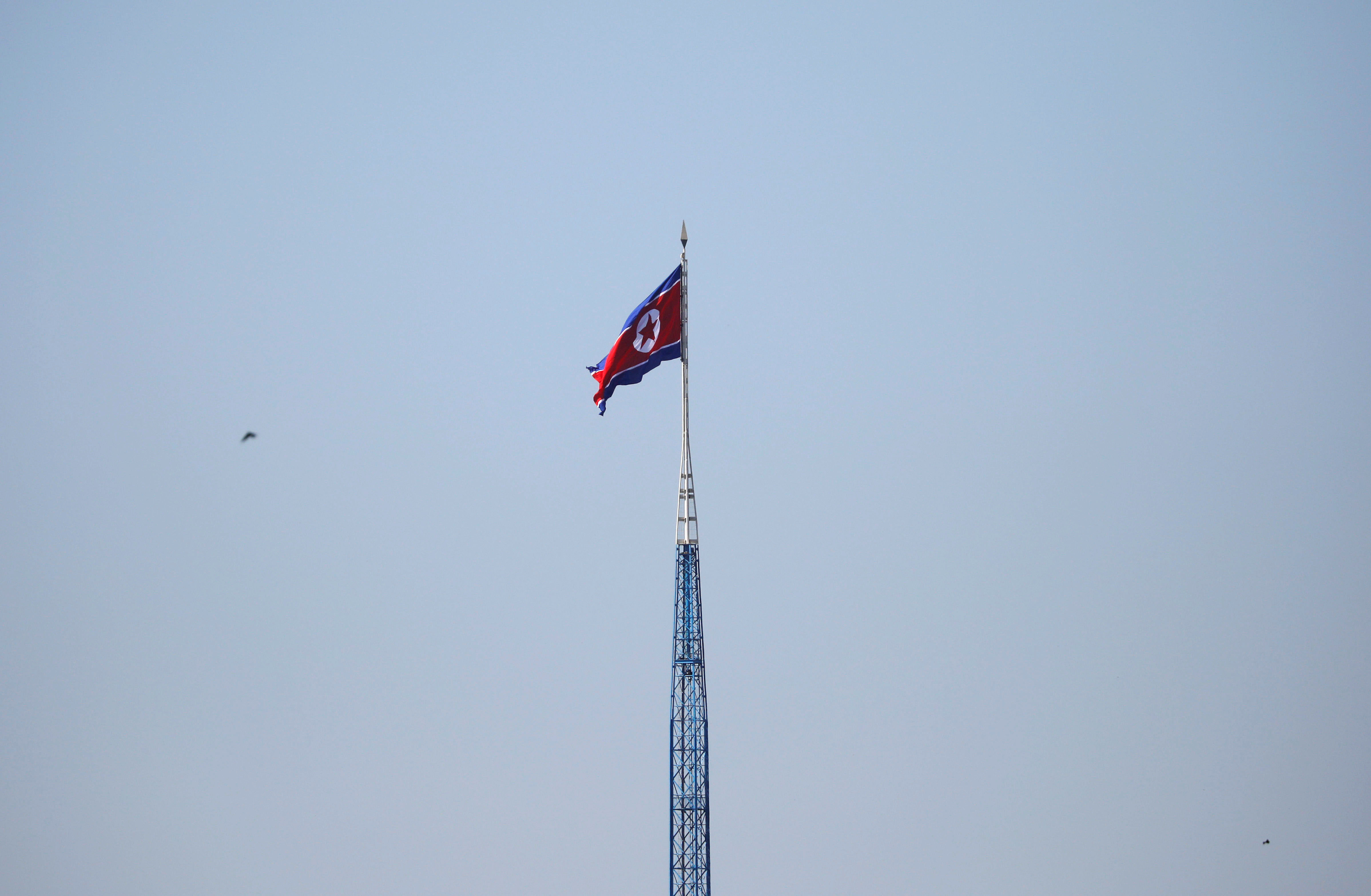 A North Korean flag flutters on top of a tower at the propaganda village of Gijungdong in North Korea, in this picture taken near the truce village of Panmunjom