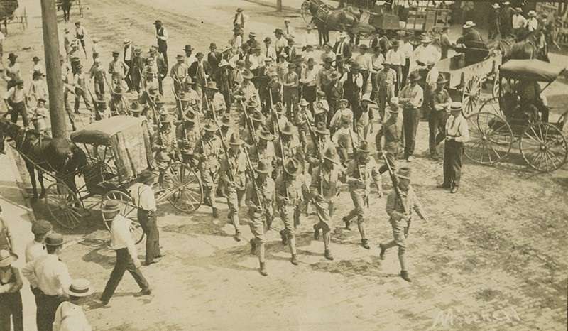 Troops march after an August 1908 race riot in Springfield