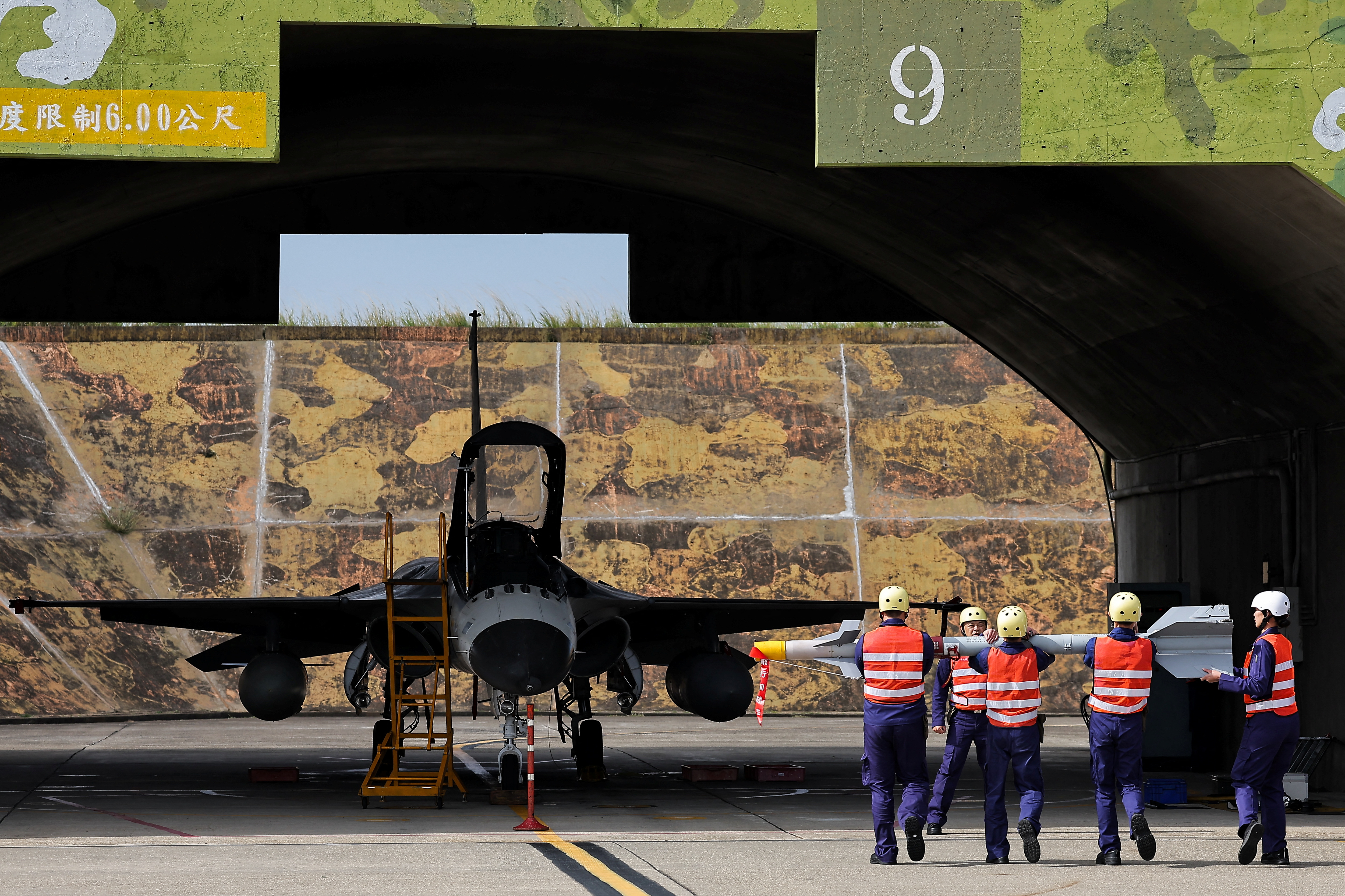 Ground crew prepare to install the Sky Sword II on an IDF jet as Taiwan military demonstrates combat readiness ahead of upcoming Lunar New Year