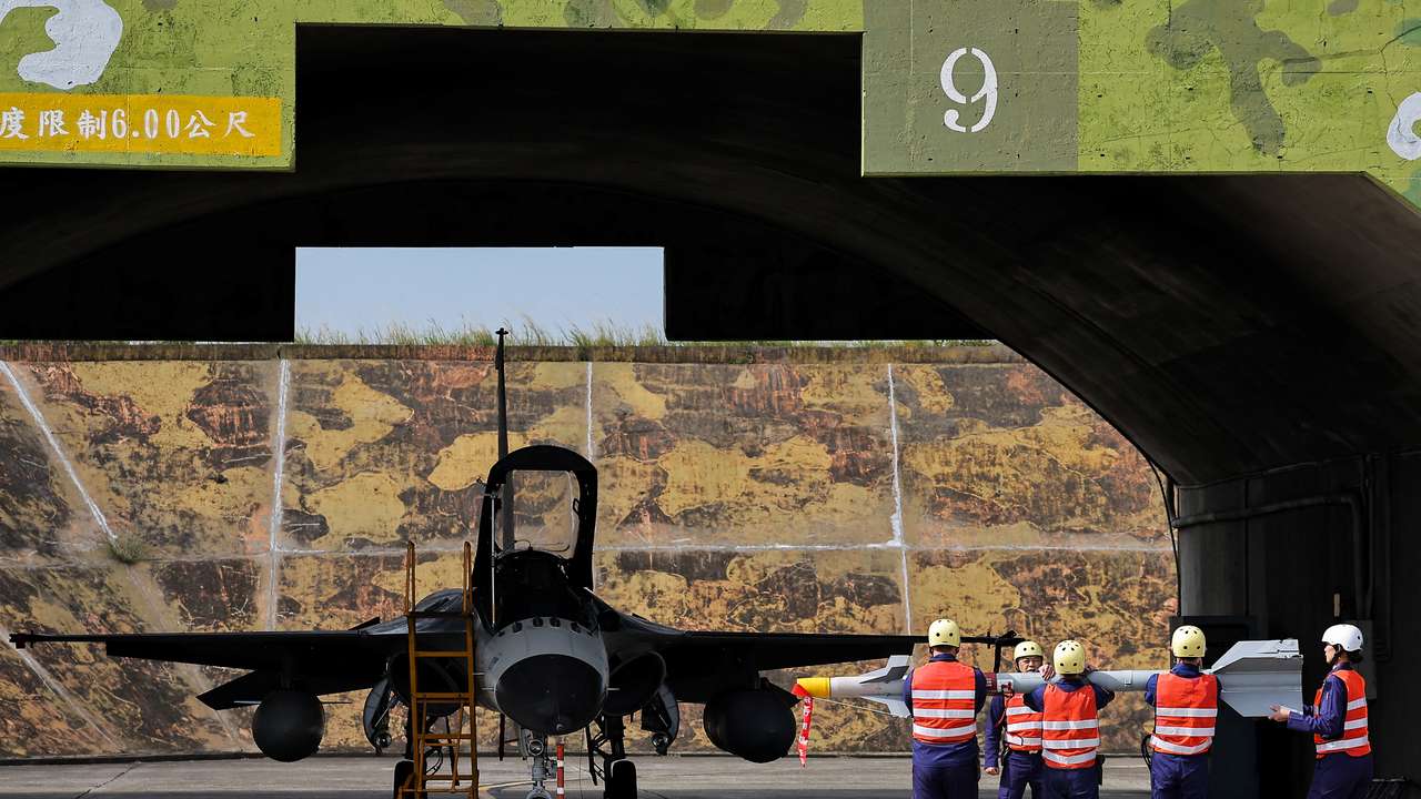 Ground crew prepare to install the Sky Sword II on an IDF jet as Taiwan military demonstrates combat readiness ahead of upcoming Lunar New Year