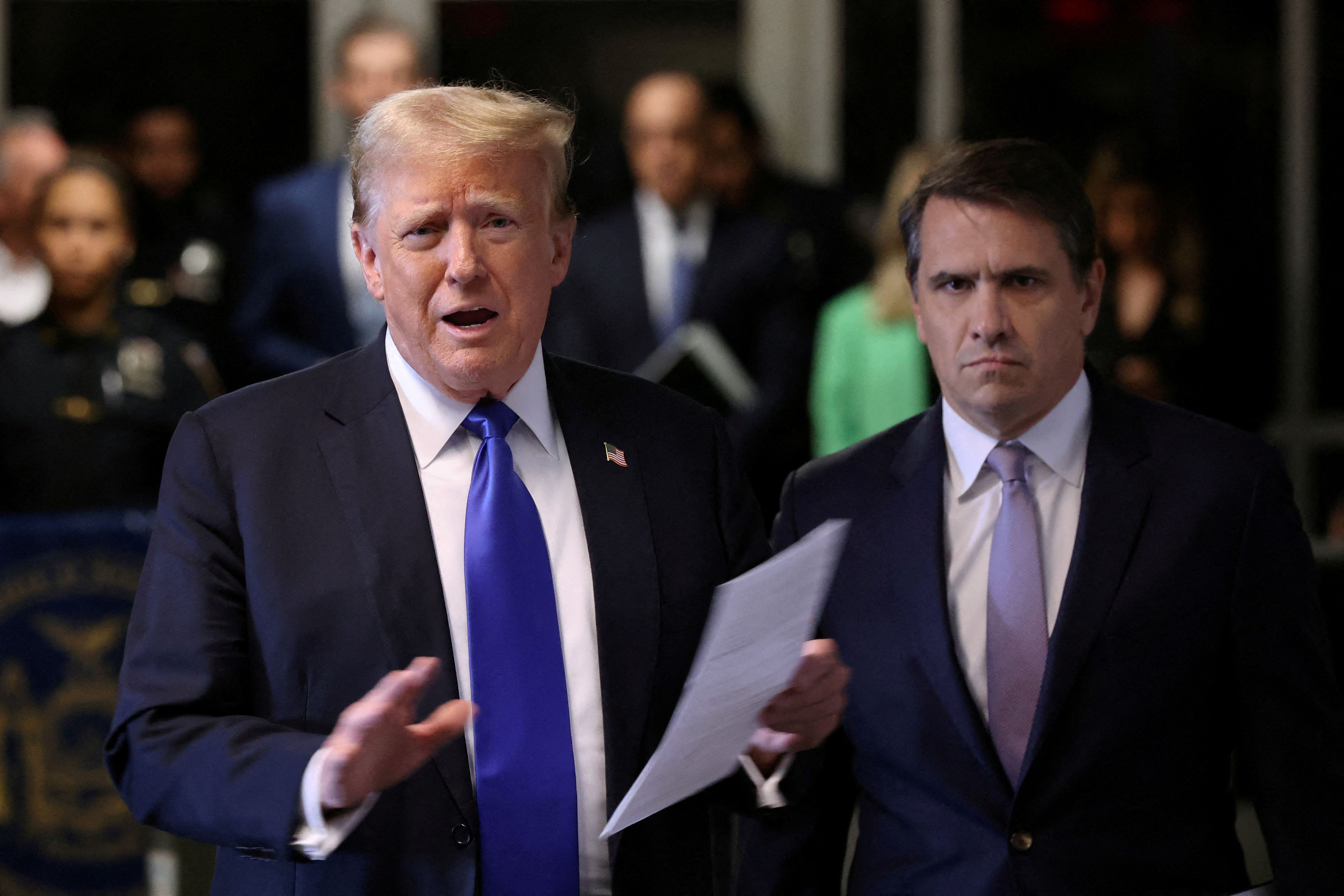 FILE PHOTO: Donald Trump attends his hush money trial in New York in May