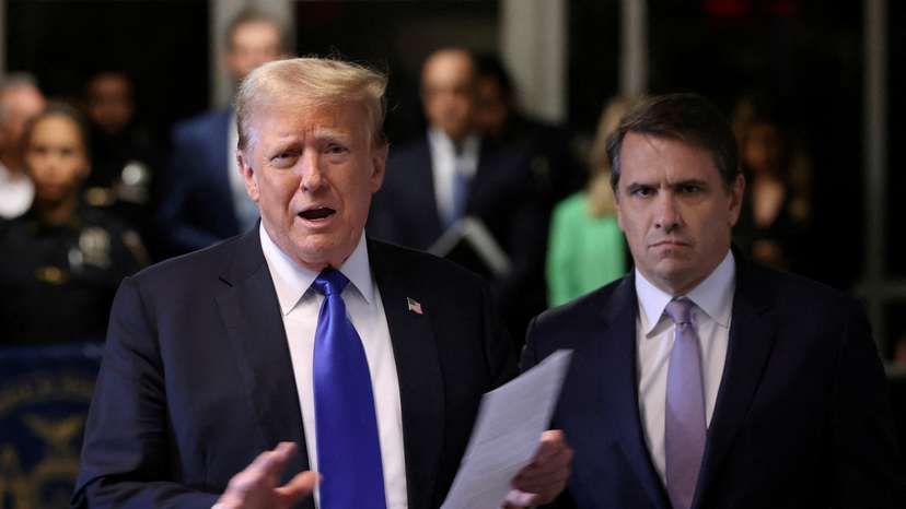 FILE PHOTO: Donald Trump attends his hush money trial in New York in May