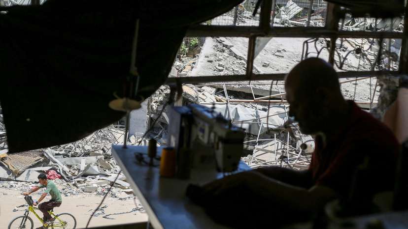 Damaged Gaza sewing factory reopens as tailors struggle to make ends meet