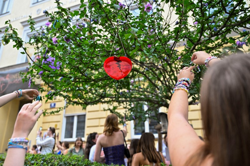 Fans gather after the government confirmed a planned attack at the venue of three Taylor Swift concerts, in Vienna