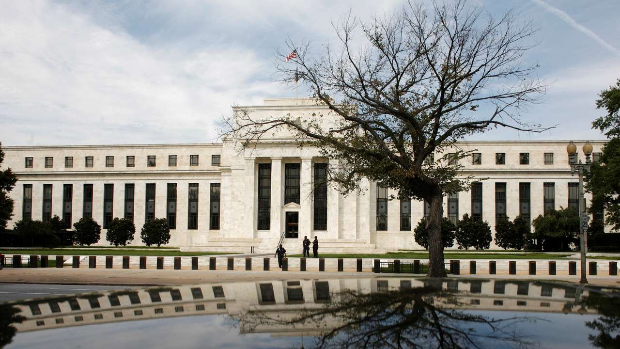 FILE PHOTO: The Federal Reserve Building is reflected on a car in Washington