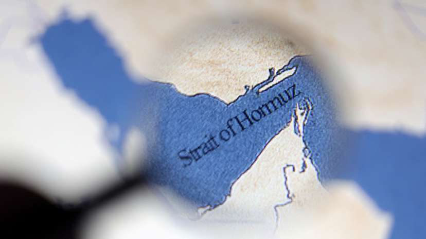 Illustration shows map showing the Strait of Hormuz and Iran