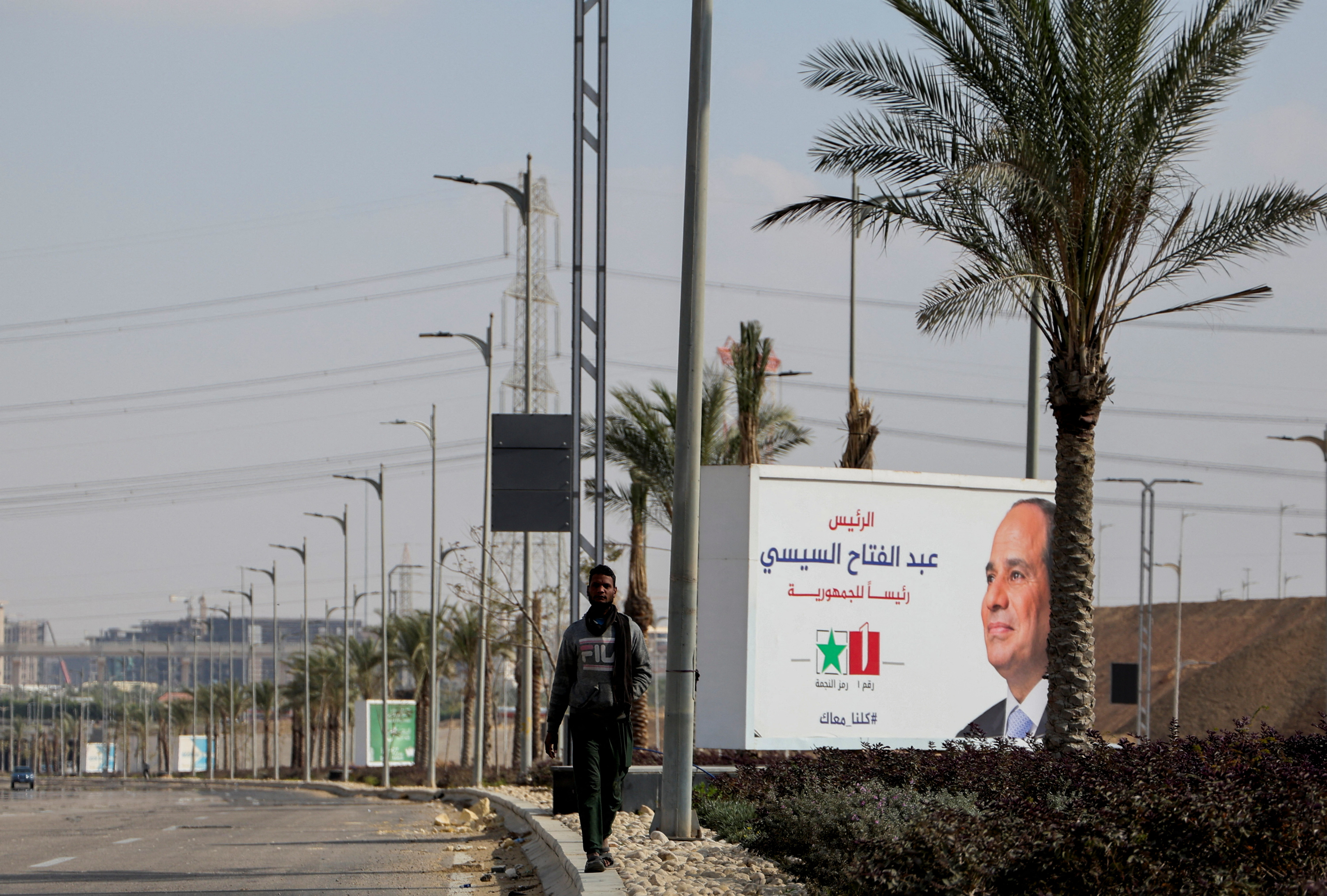 Banners supporting presidential candidate and current Egyptian President Abdel Fattah al-Sisi stand at the New Administrative Capital in the desert east of Cairo