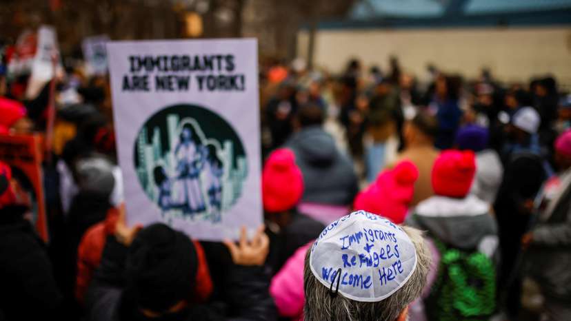 People take part in a rally against Trump's policy of immigration in New York