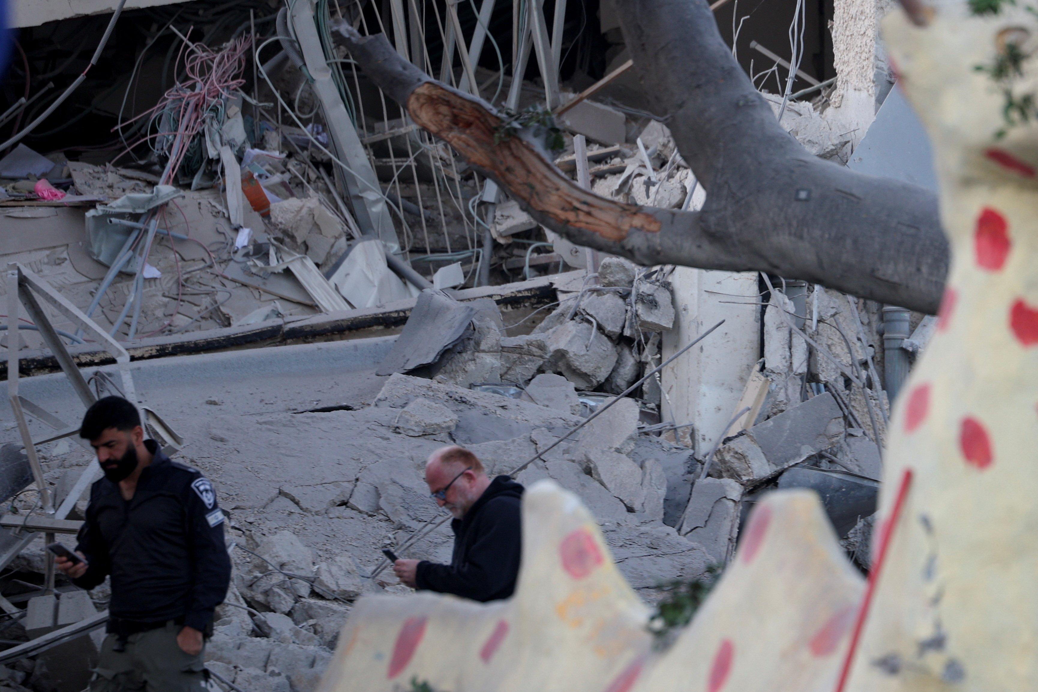 Scenes from a damaged site after a projectile fired from Yemen was intercepted, in Ramat Gan