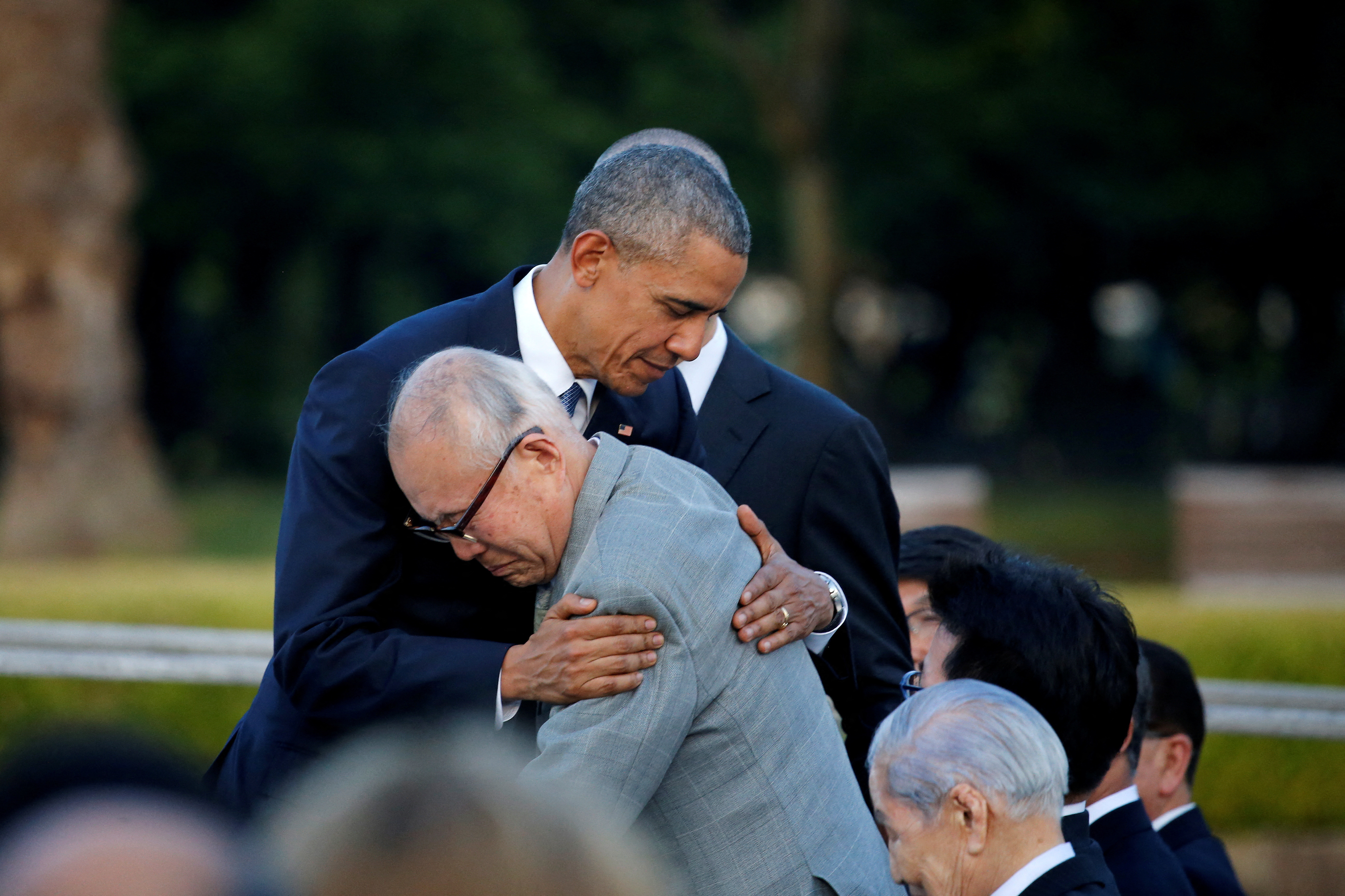 FILE PHOTO: U.S. President Barack Obama (L) hugs atomic bomb survivor Shigeaki Mori as he visits Hiroshima Peace Memorial Park in Hiroshima, Japan