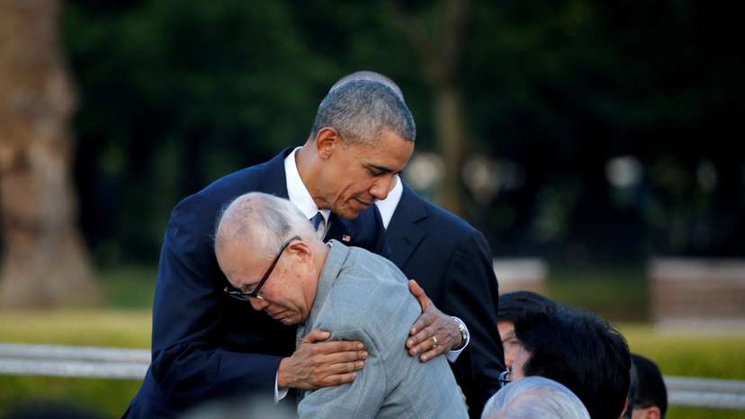 FILE PHOTO: U.S. President Barack Obama (L) hugs atomic bomb survivor Shigeaki Mori as he visits Hiroshima Peace Memorial Park in Hiroshima, Japan