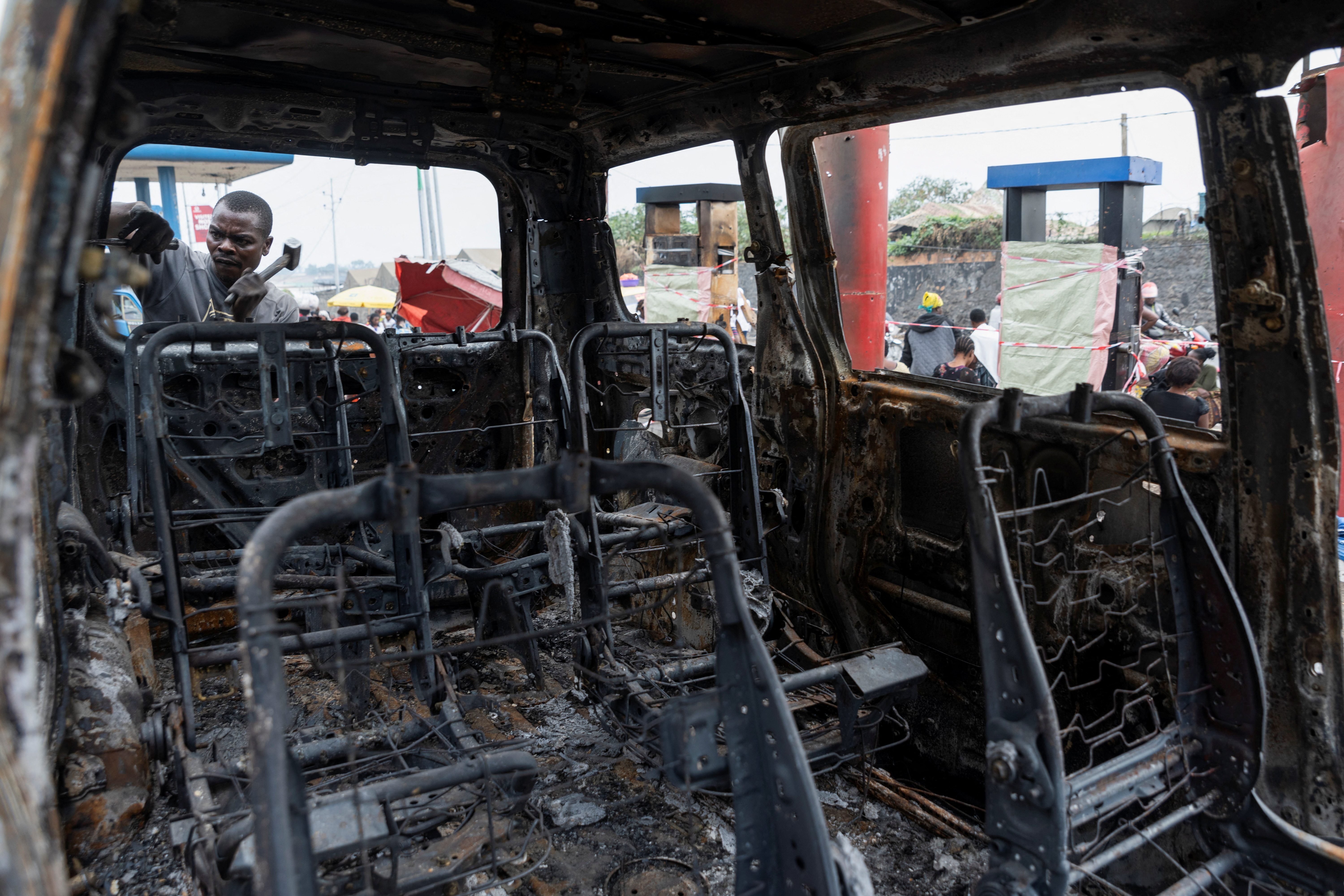 Residents survey damage from fighting between M23 rebels and Congolese forces in Goma
