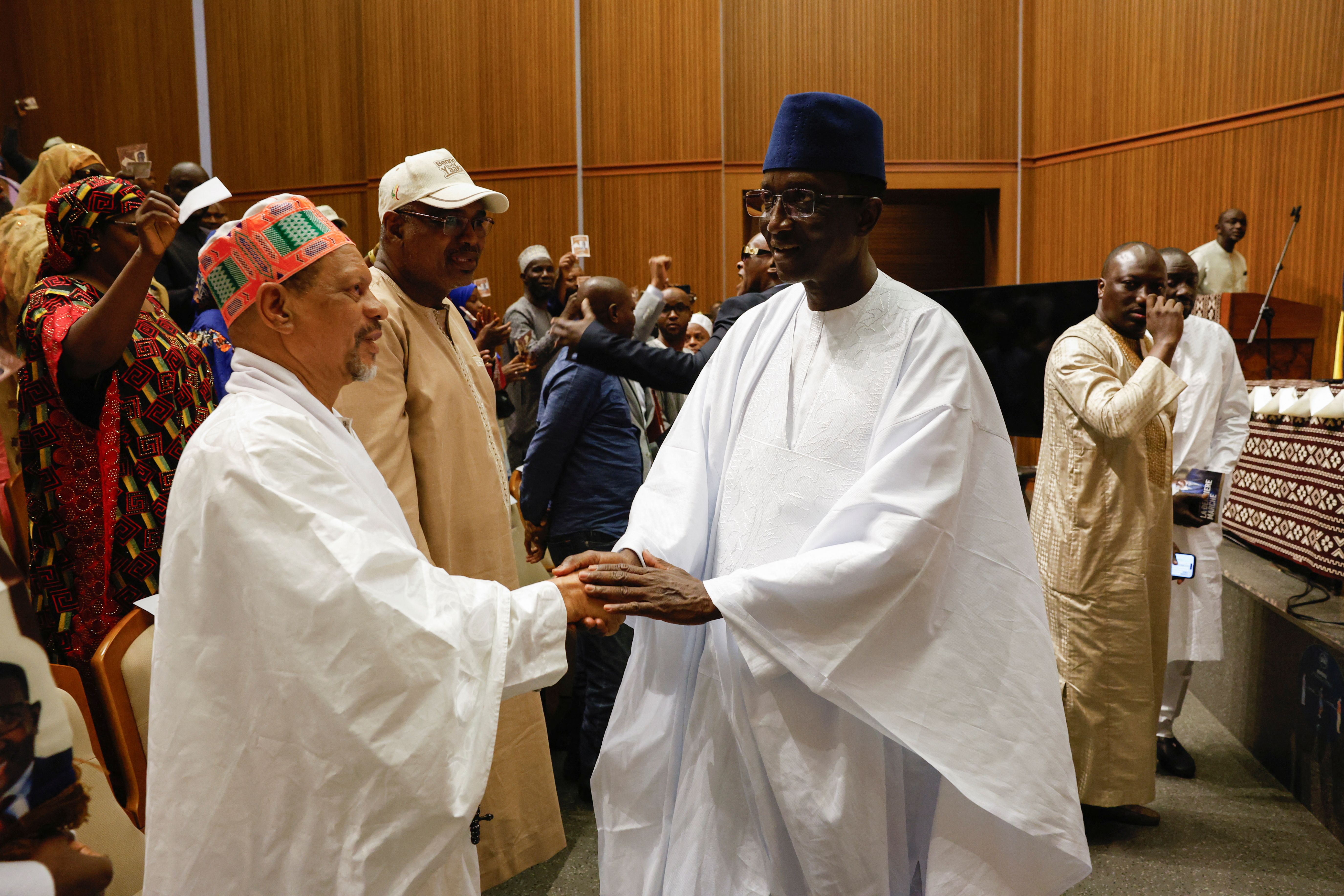 The Senegalese presidential candidate, Amadou Ba of Senegalese President Macky Sall's ruling coalition shakes hands with a supporter, in Dakar