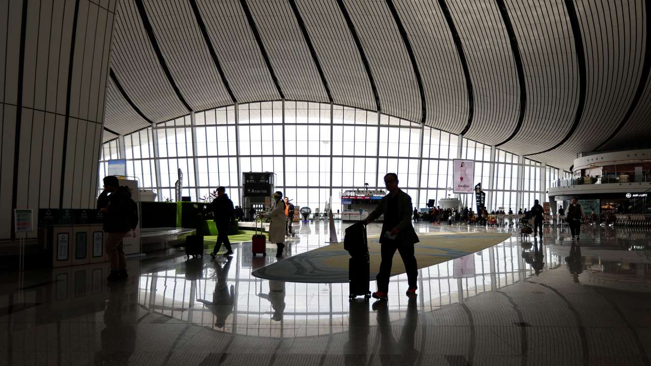 Travellers at Beijing Daxing International Airport