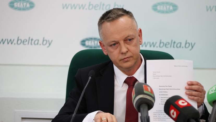 FILE PHOTO: Tomasz Szmydt, a Polish judge who requested political asylum in Belarus, attends a press conference in Minsk