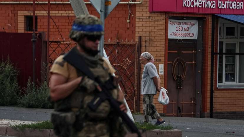 FILE PHOTO: A Ukrainian serviceman patrols in the town of Sudzha