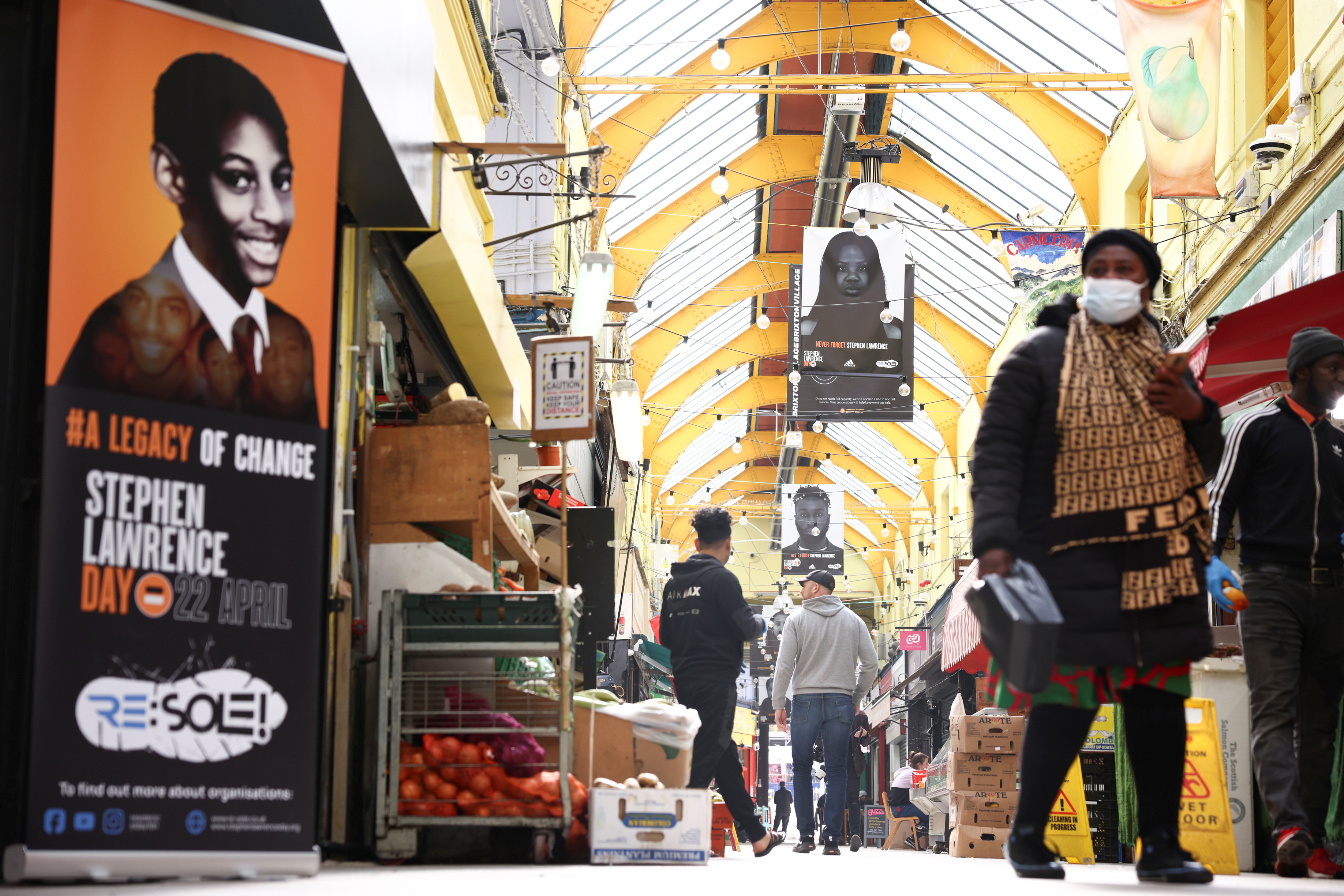 General view of the exhibition 'Never Forget Stephen Lawrence', comprised of 29 flags installed in Brixton Village ahead of National Stephen Lawrence Day