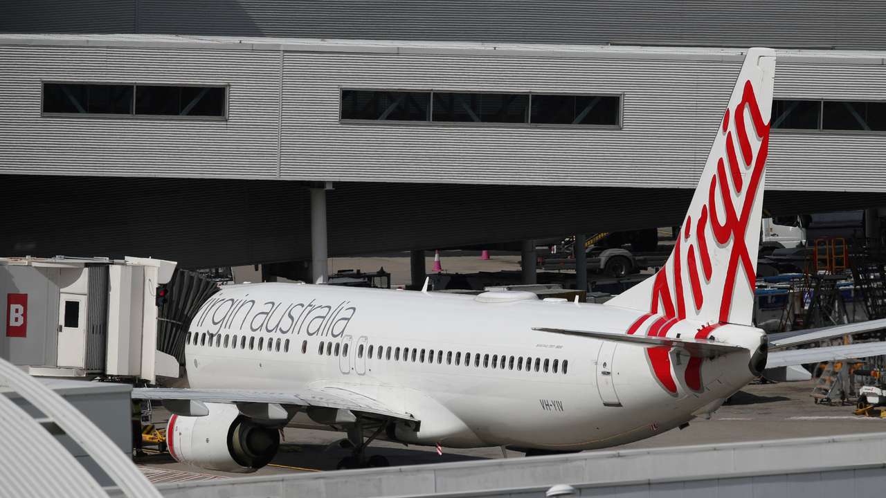 A Virgin Australia Airlines plane is seen at Kingsford Smith International Airport after Australia implemented an entry ban on non-citizens and non-residents due to the coronavirus disease (COVID-19) in Sydney