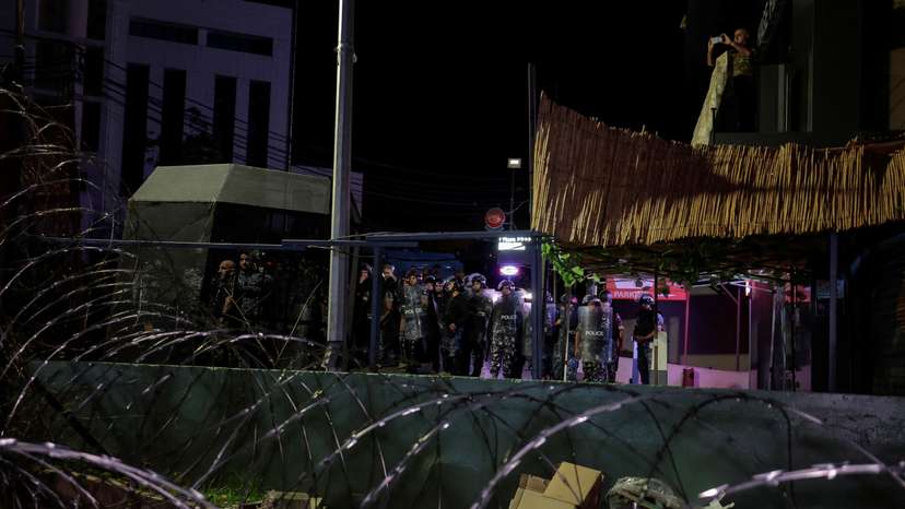 Lebanese security forces stand guard the U.S. embassy as people protest after hundreds of Palestinians were killed in a blast at Al-Ahli hospital in Gaza that Israeli and Palestinian officials blamed on each other, in Beirut,