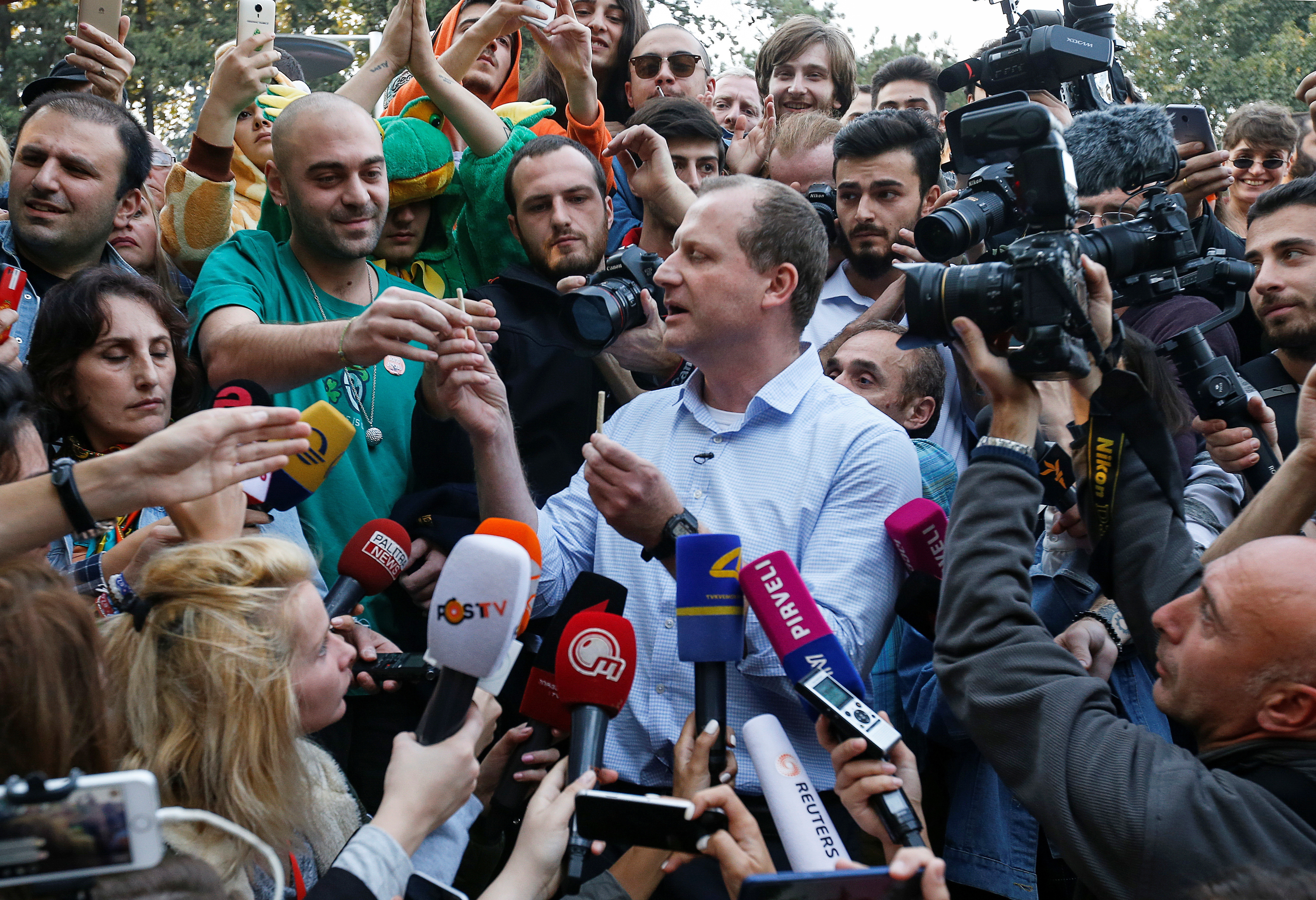 Zurab Japaridze, leader of opposition Girchi party and presidential candidate for the upcoming election, gives joints to his supporters at the first "Cannabis Legalization Festival" in Tbilisi
