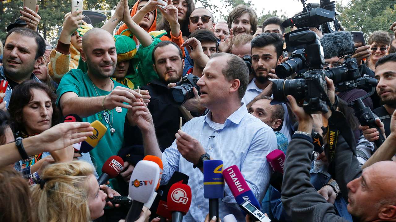 Zurab Japaridze, leader of opposition Girchi party and presidential candidate for the upcoming election, gives joints to his supporters at the first "Cannabis Legalization Festival" in Tbilisi