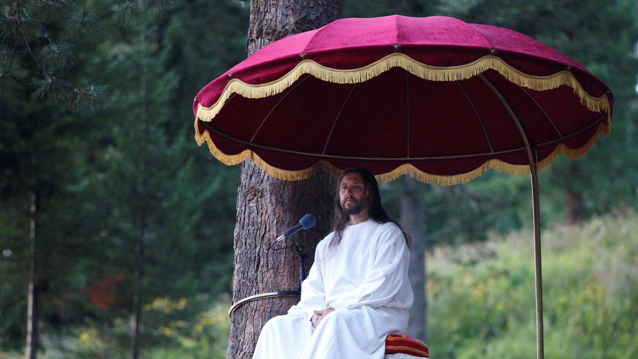 FILE PHOTO: Vissarion, who has proclaimed himself a new Christ, conducts a service during the Holiday of Good Fruit feast in the village of Obitel Rassveta