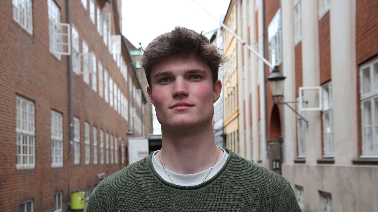 Harvard student Alfred Williamson, who comes from Wales, stands in a street in Copenhagen