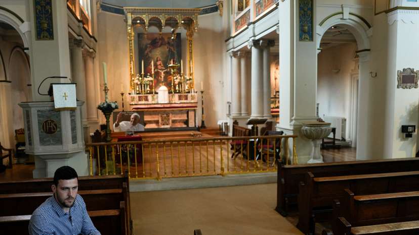 Joshua Steel listens during an interview with Reuters afters the Sunday service at St Elizabeth of Portugal Church in Richmond, south-west London