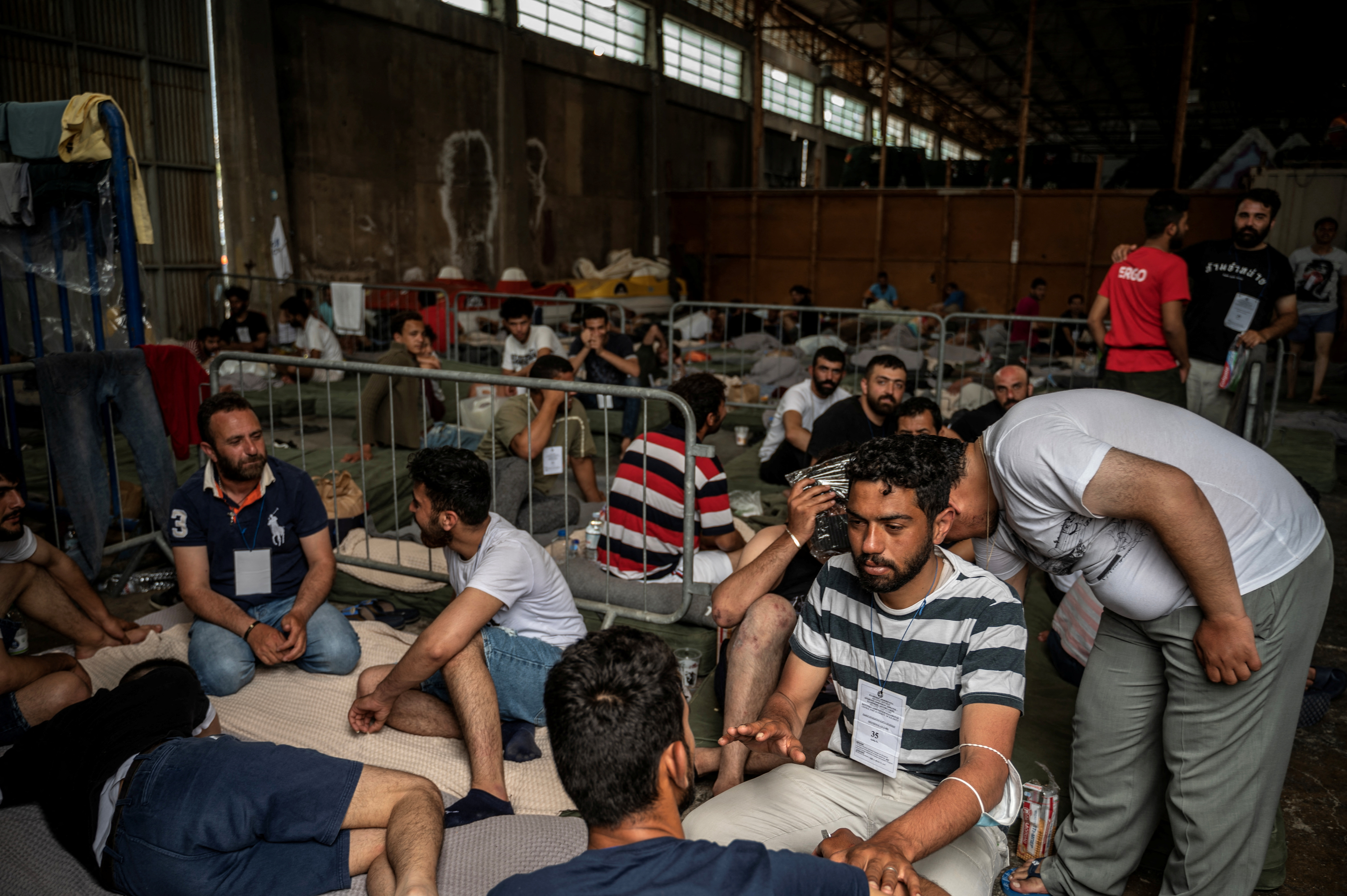 Rescued migrants at the port of Kalamata following a rescue operation