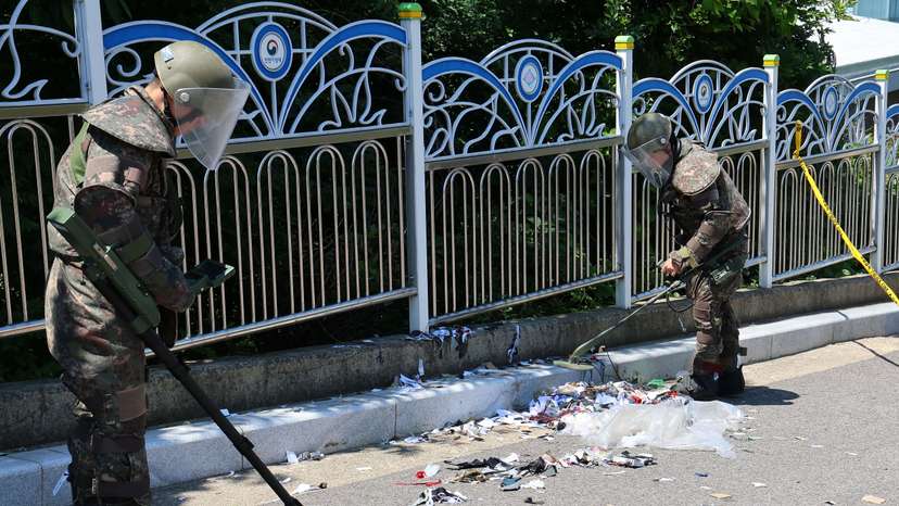 South Korean soldiers examine various objects including what appeared to be trash from a balloon believed to have been sent by North Korea, in Incheon