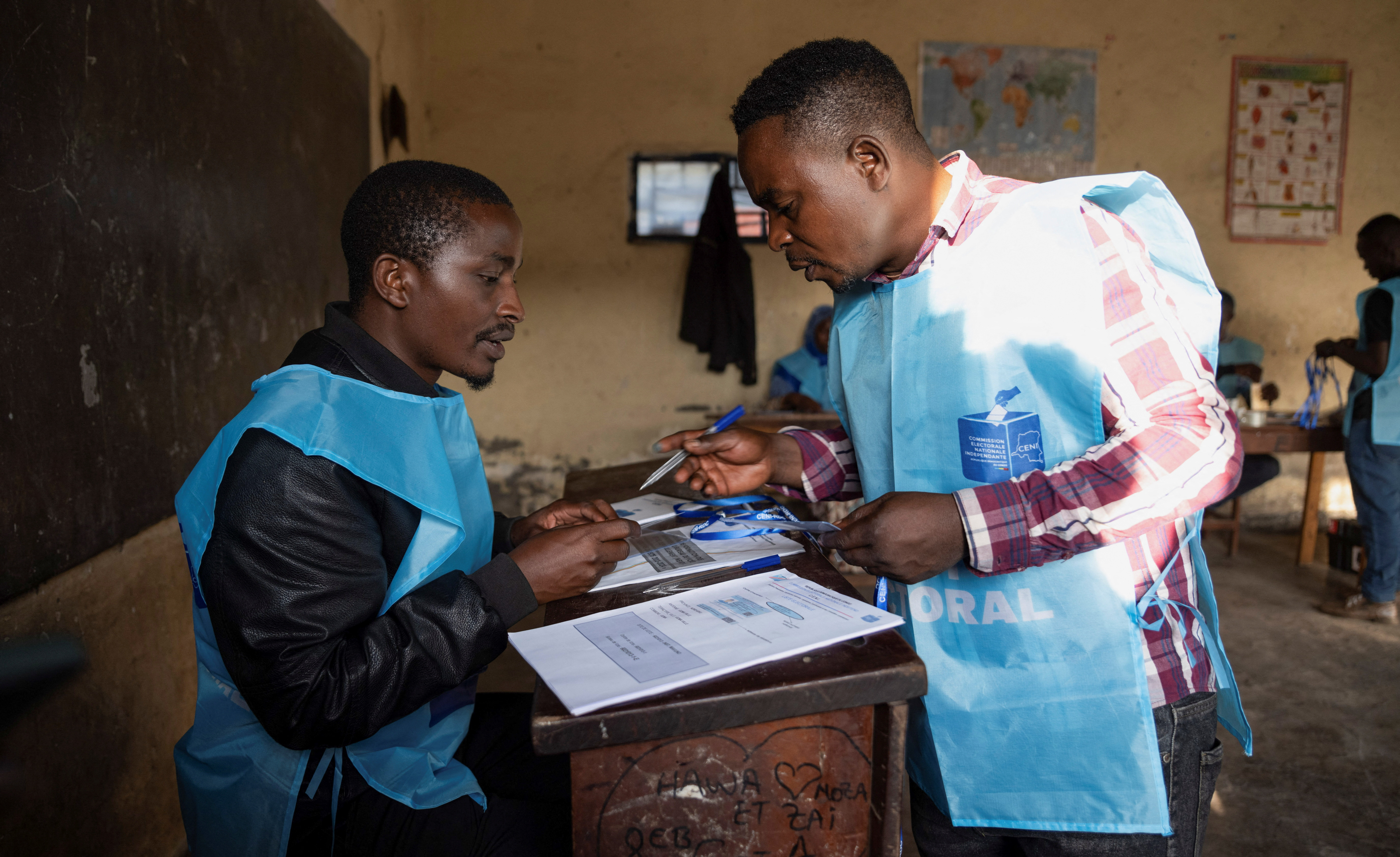 CENI agent checks electoral materials at the Mavuno polling centre on the day of the presidential election in Goma