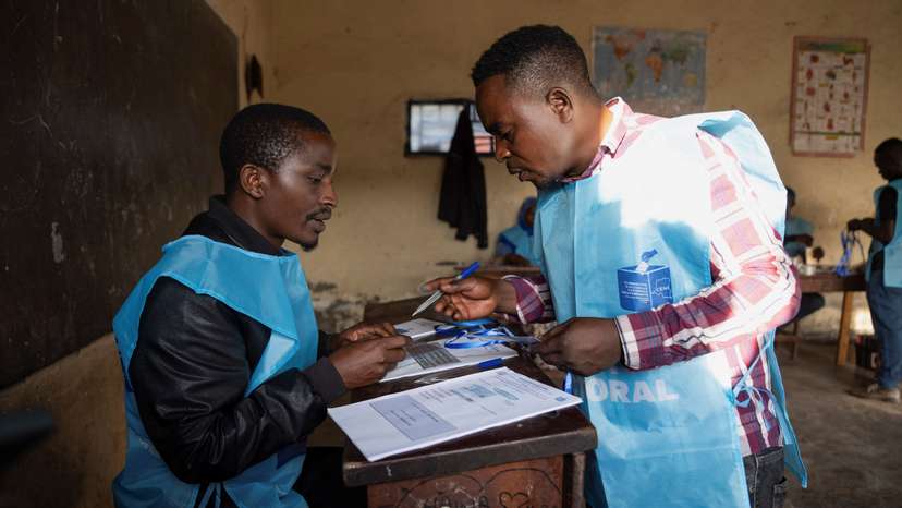 CENI agent checks electoral materials at the Mavuno polling centre on the day of the presidential election in Goma