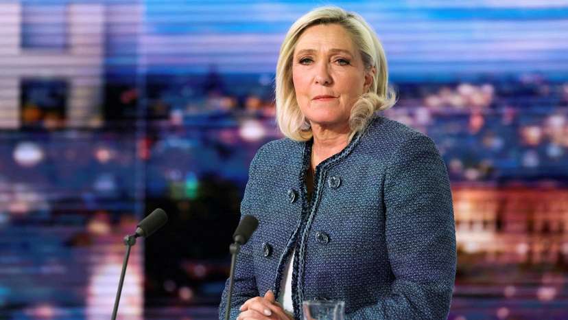 President of the far-right Rassemblement National (RN) parliamentary group Marine Le Pen poses prior to an interview on the evening news broadcast of French TV channel TF1, in Boulogne-Billancourt