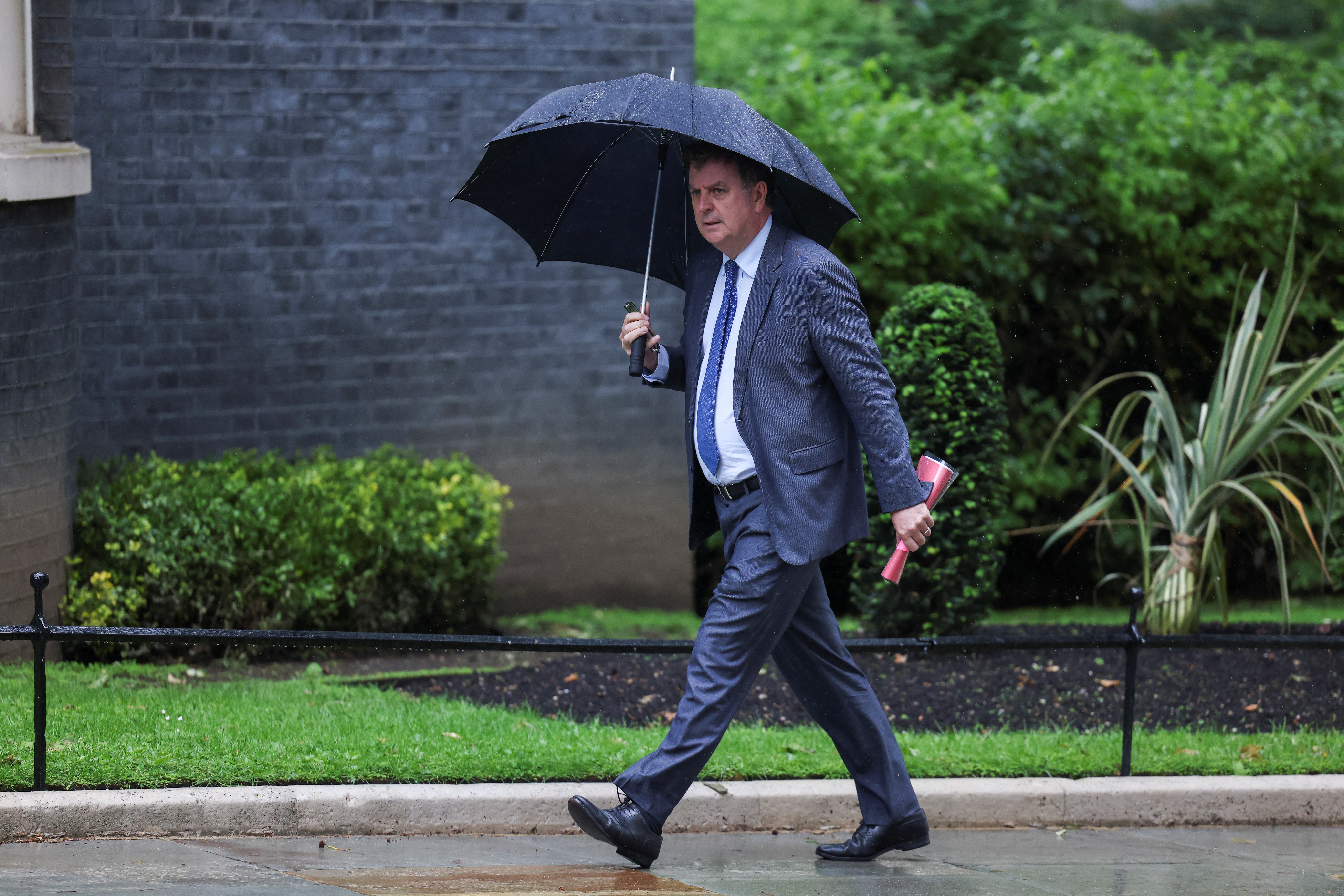 FILE PHOTO: British Secretary of State for Work and Pensions Mel Stride walks on Downing Street, in London