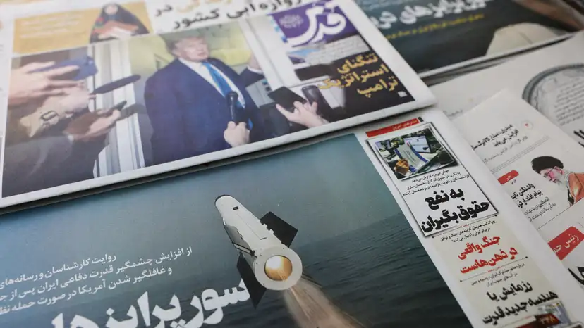 An Iranian newspaper with a cover photo of an Iranian missile, in Tehran
