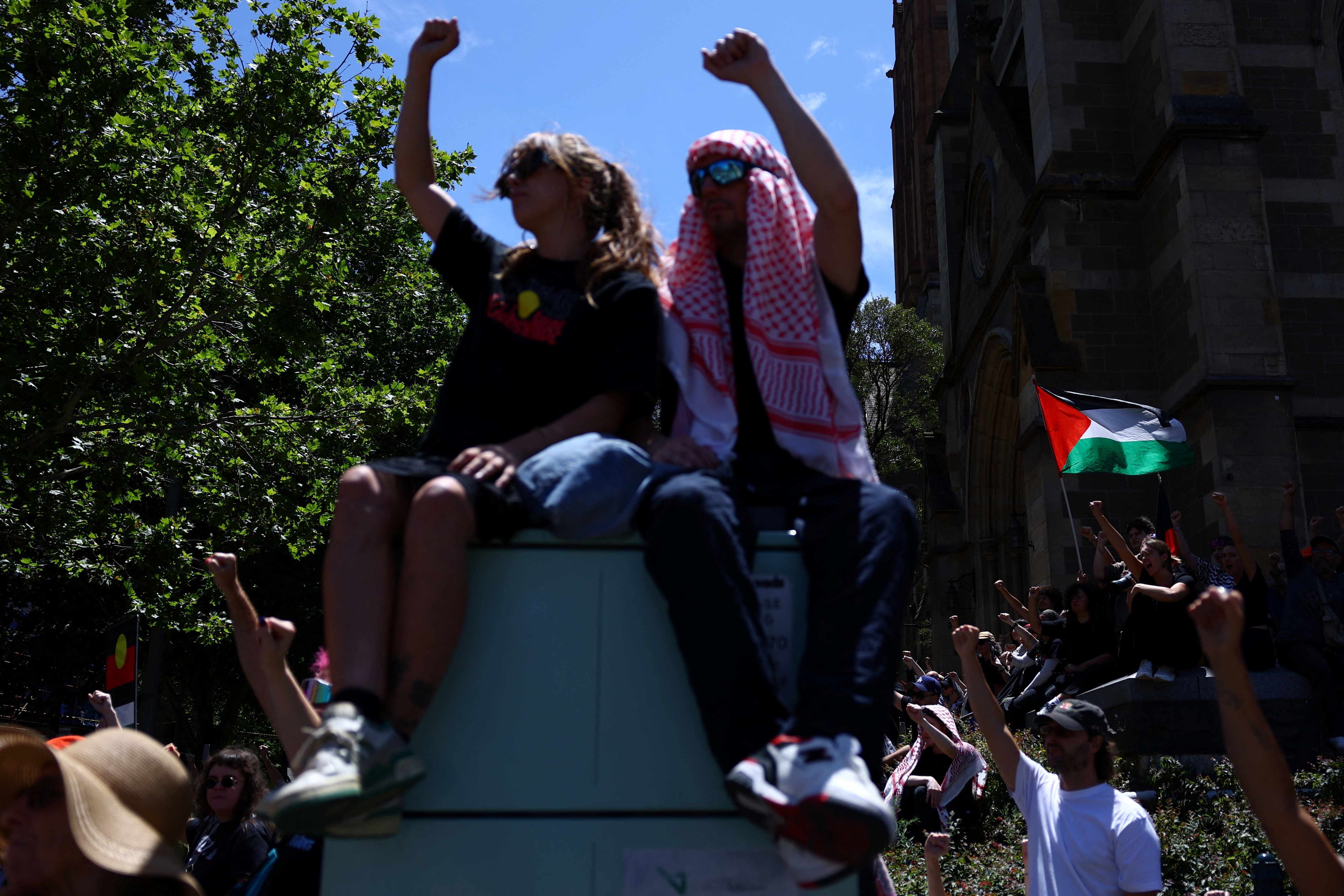 Pro-Palestinian and "Invasion Day" protesters gather at a rally on Australia's National Day outside Flinders Street Station in Melbourne, Australia
