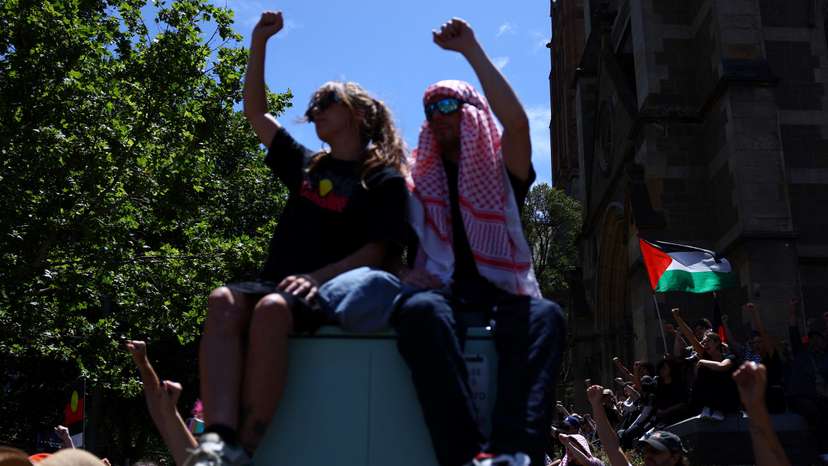 Pro-Palestinian and "Invasion Day" protesters gather at a rally on Australia's National Day outside Flinders Street Station in Melbourne, Australia