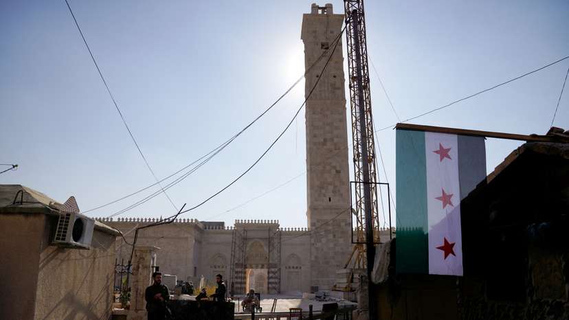 Rebel fighters outside Umayyad Mosque in Aleppo