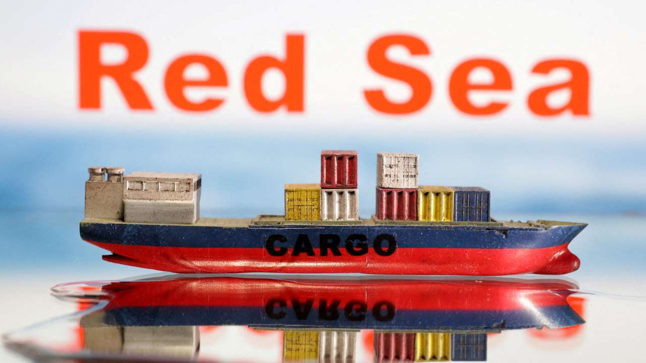 FILE PHOTO: Illustration shows a cargo ship boat model and "Red Sea" words