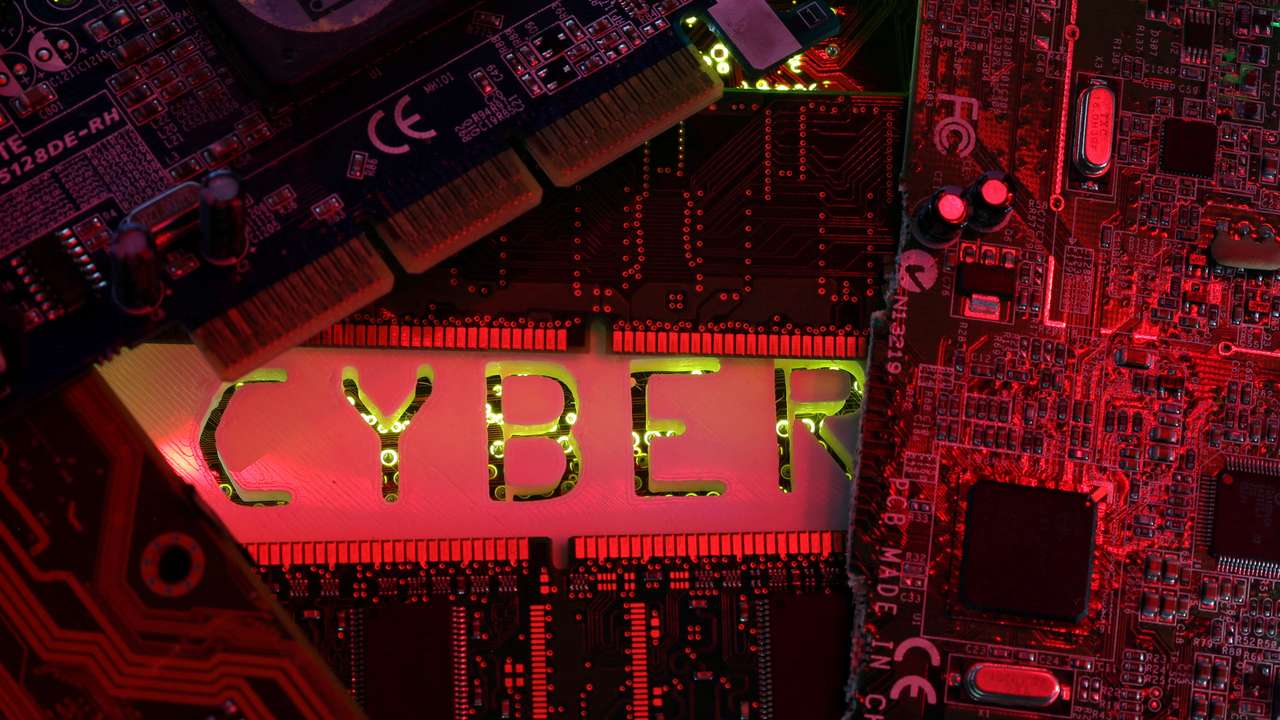 A 3D-printed Cyber word standing on PC motherboard is seen in this illustration picture