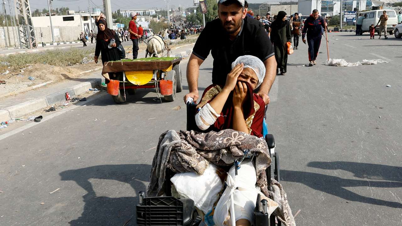 Palestinians fleeing north Gaza move southward, in the central Gaza Strip