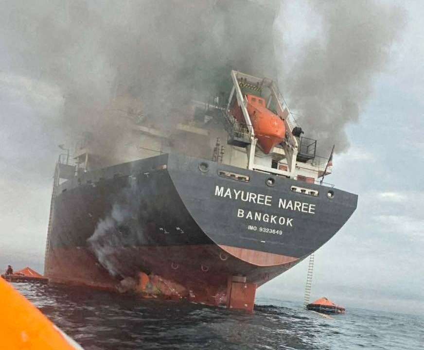 The Thailand-flagged cargo ship Mayuree Naree engulfed in black smoke in the Strait of Hormuz