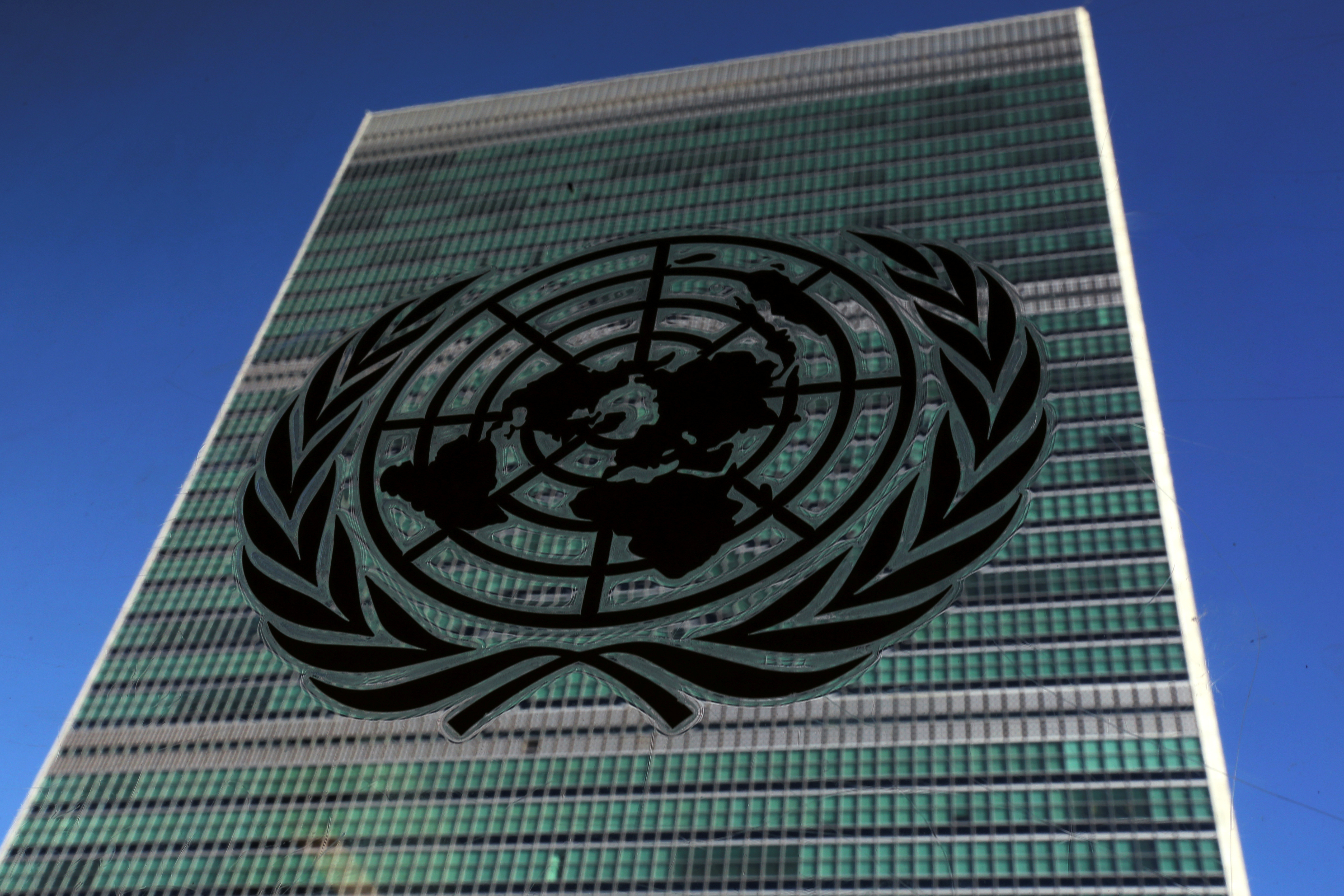 The United Nations logo is pictured in front of the United Nations Headquarters building during the 71st United Nations General Assembly in the Manhattan borough of New York