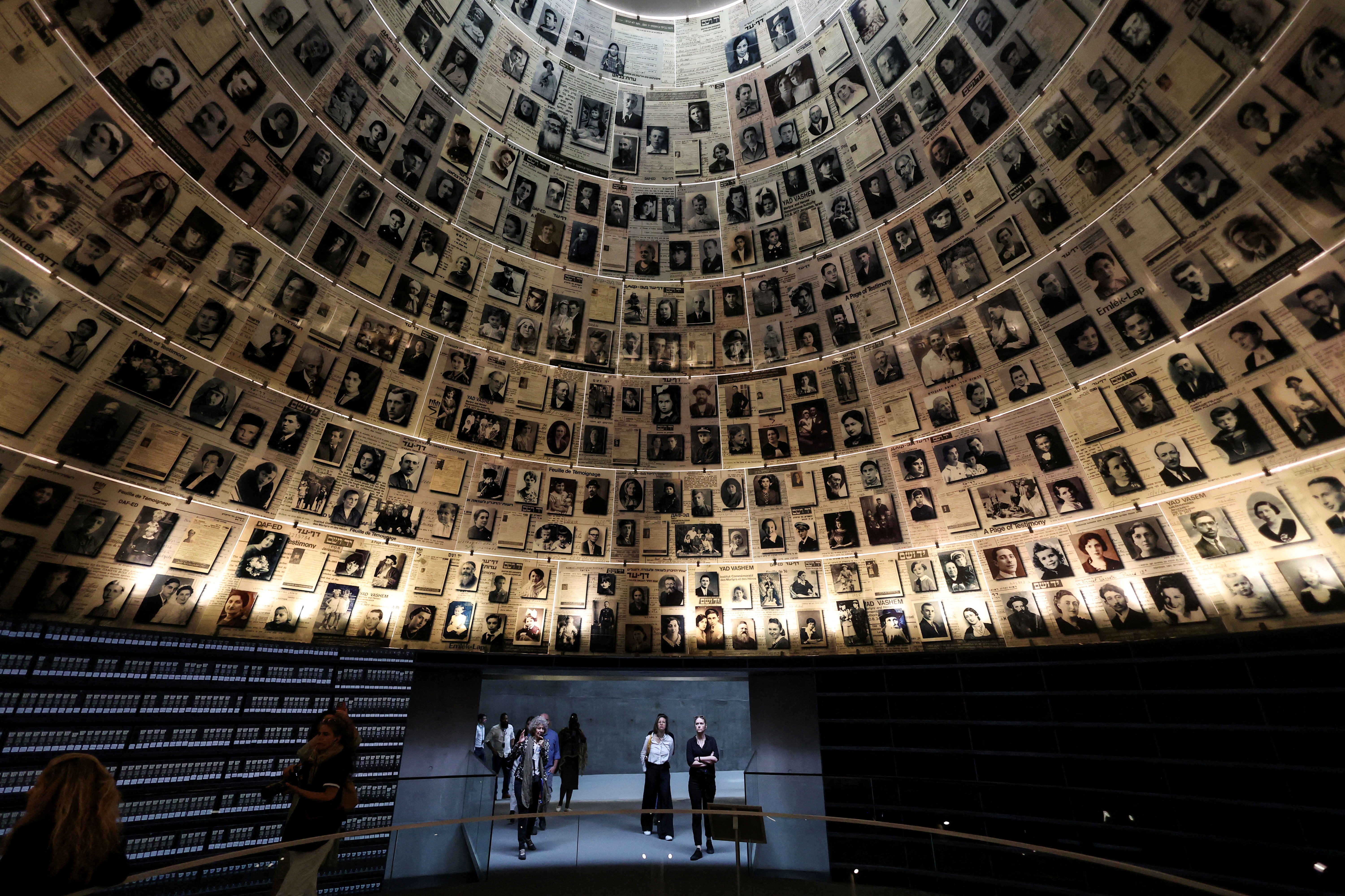 FILE PHOTO: Visitors tour an exhibition ahead of Israel's national Holocaust memorial day, at Yad Vashem in Jerusalem