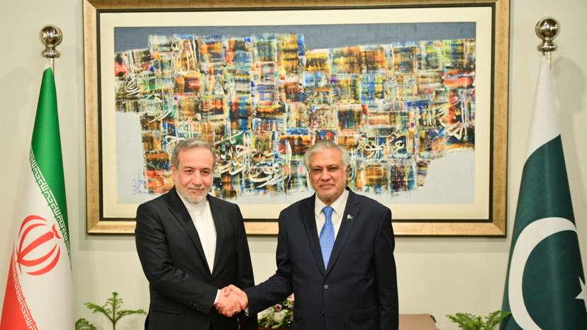 Pakistan's Foreign Minister Ishaq Dar greets Iran's Foreign Minister Abbas Araghchi upon his arrival in Islamabad