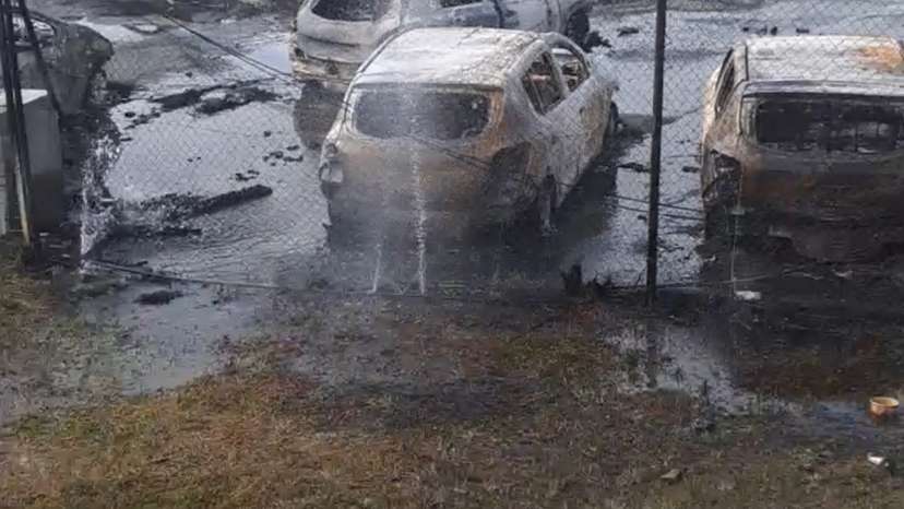 Burnt cars in the aftermath of protests that turned violent, in Noumea